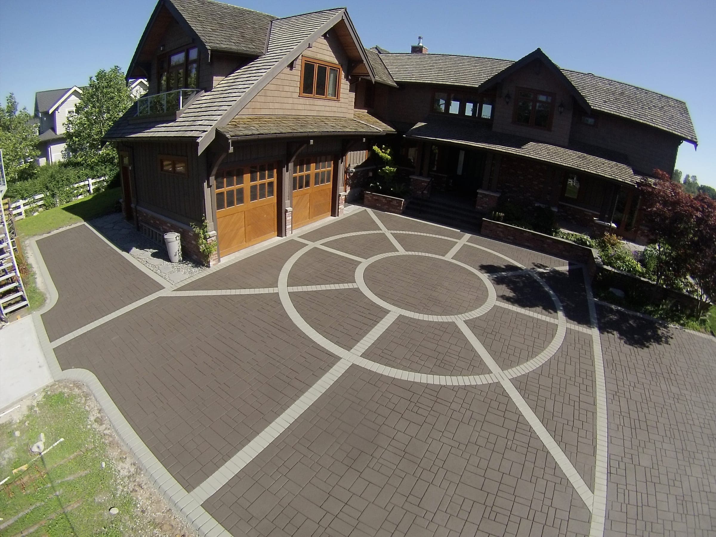 Driveway with circle medallion in StreetPrint, Vancouver, BC. Installed by Square One Paving.