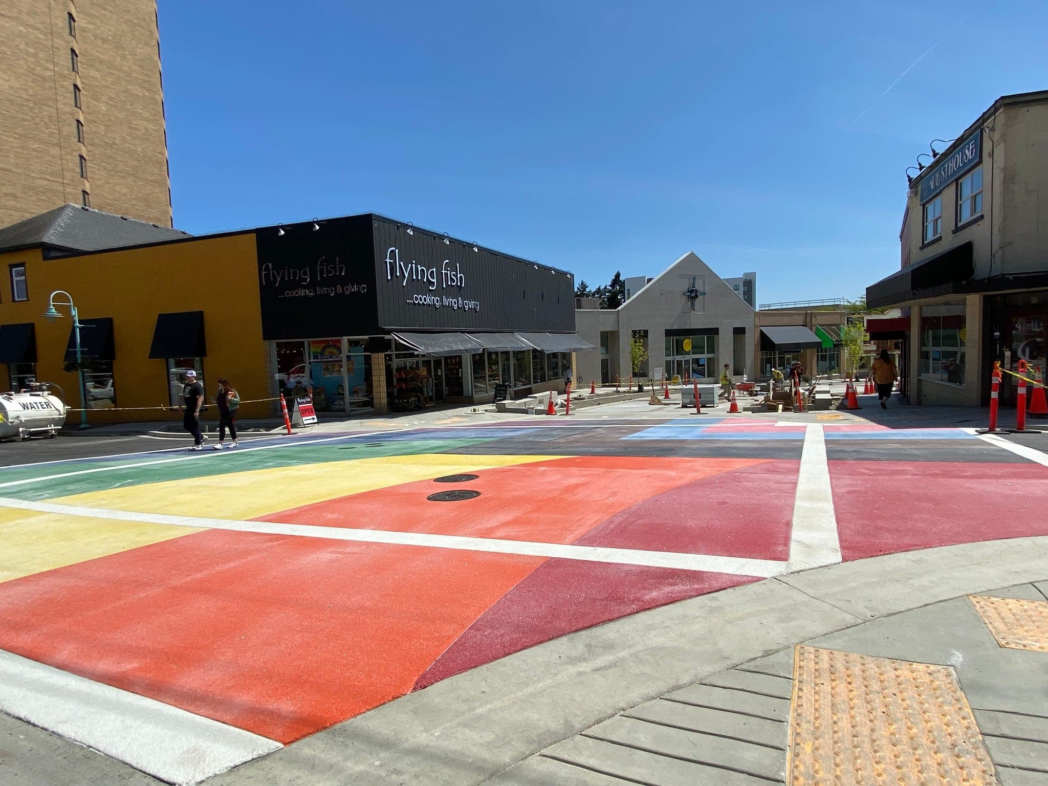 The rainbow intersection in Nanaimo at street level, bands of TrafficPatternsXD colour across the road in front of the shops