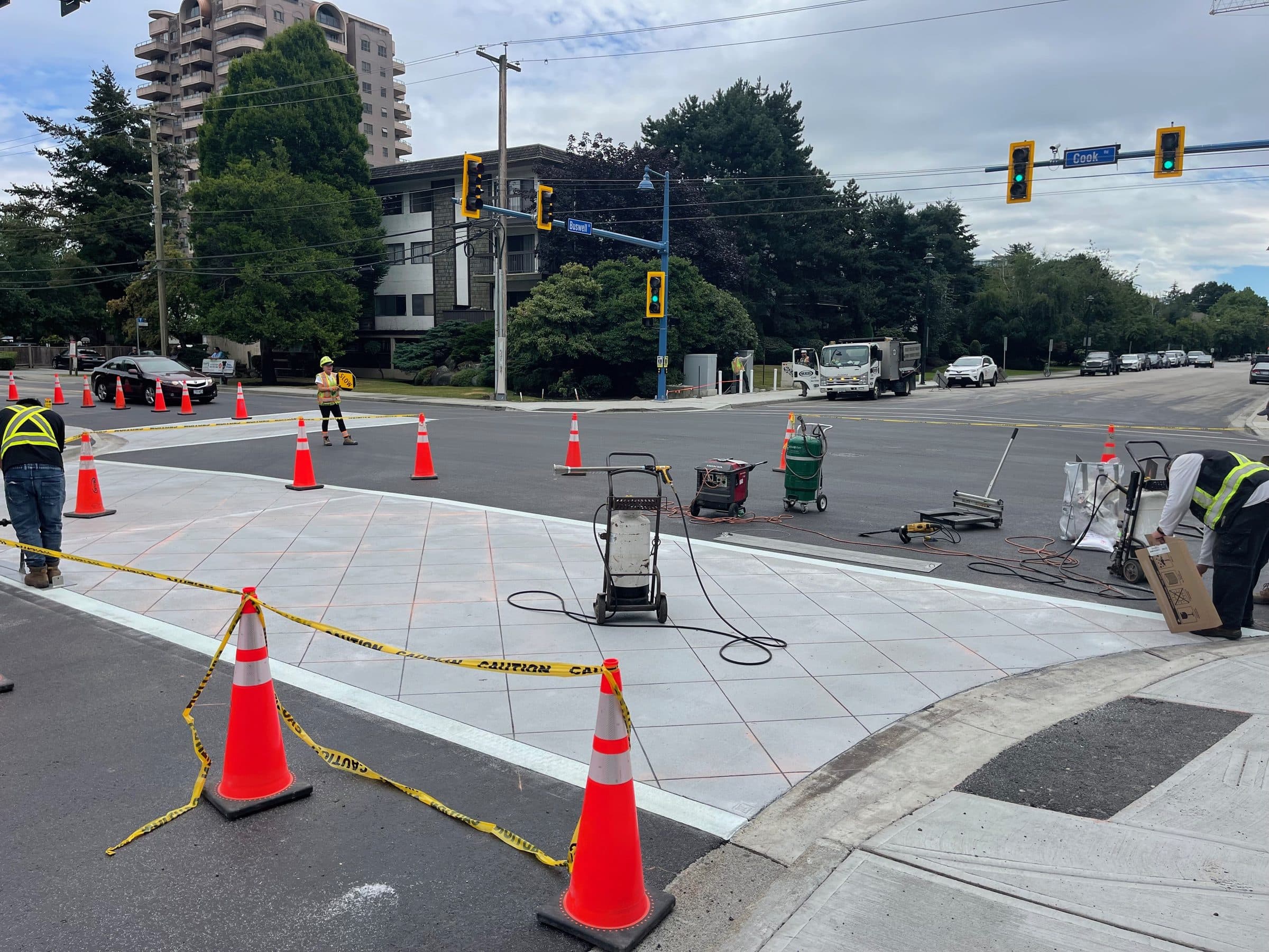 Square One's crew at a coned-off intersection in Richmond with the template laid on the crossing