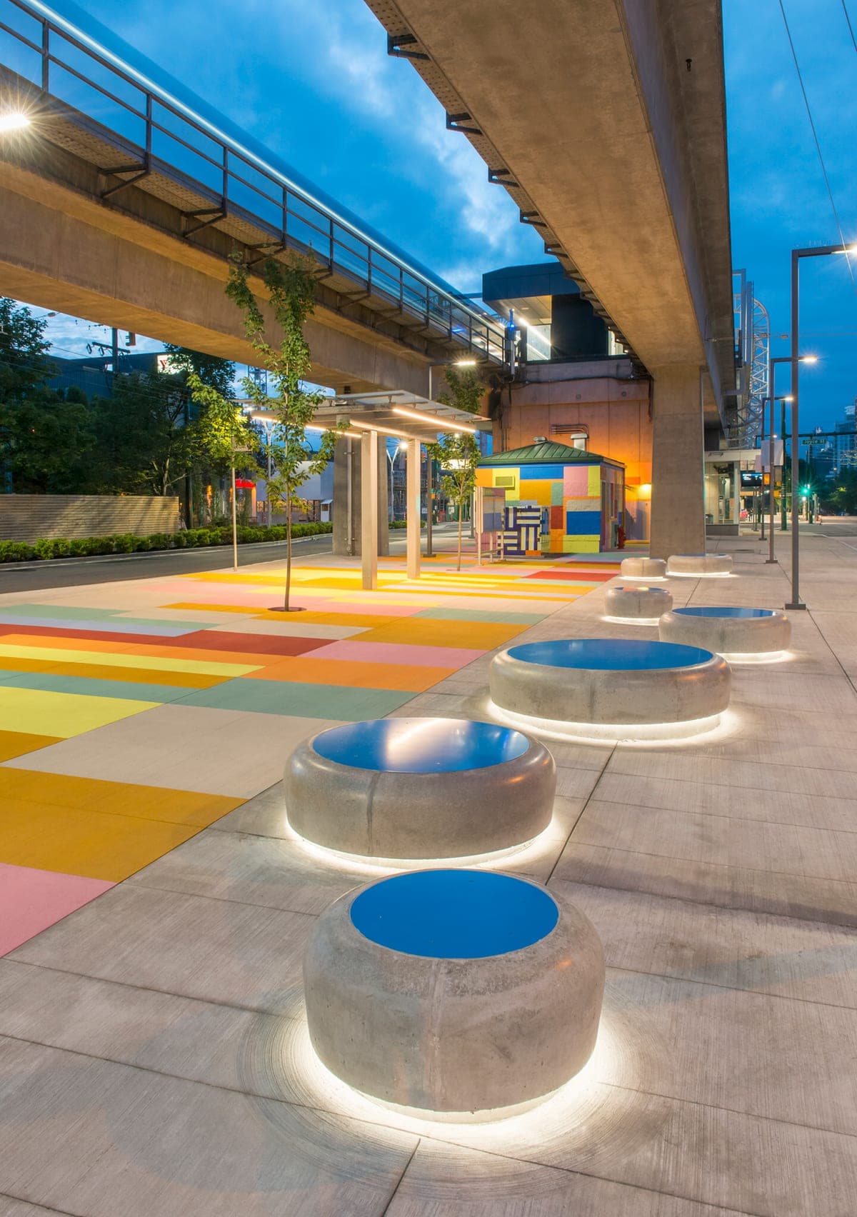 StreetBond multicolour plaza at Joyce Station, Vancouver, at dusk